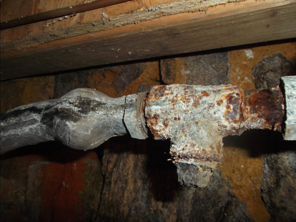 Picture of lead pipe connected to galvanized steel plumbing. Image courtesy of Reading Area Water Authority. 